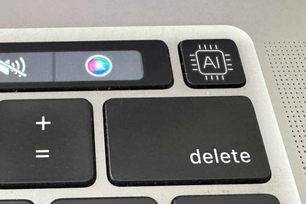 Keyboard modified with an AI key, symbolizing artificial intelligence in content creation.